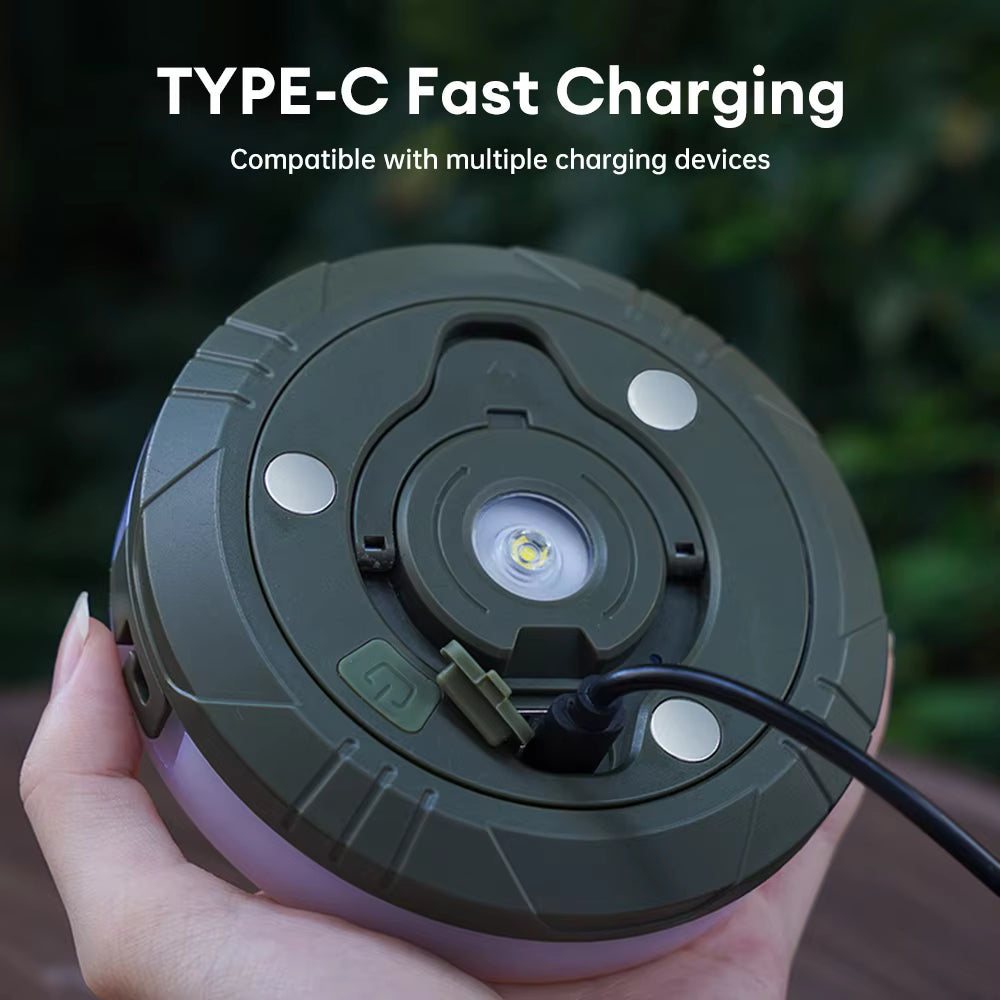 Green charging device with Type-C fast charging feature held by a hand against a blurred green background.