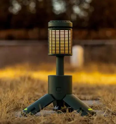 Outdoor lamp on a stand with a blurred natural background