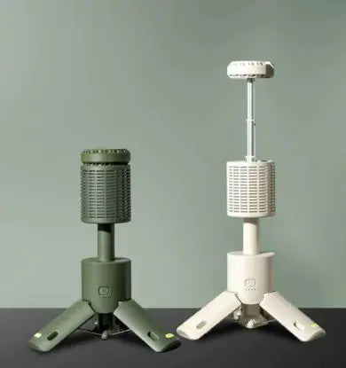 Two portable fans, one green and one white, on a gray surface with a light gray background.
